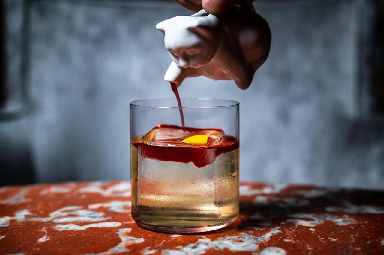 Riggs Washington Dc Otel Dış mekan fotoğraf A classic Old Fashioned cocktail being garnished with a cherry